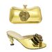 Pair the evening with a glossy glossy high heel round head fish mouth sandals and a three-dimensional decal decorated clutch set_vogvips.com
