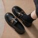 A Woman With A Small Leather Shoe With A Horse Bite And A Pair Of Shoes With A Single Shoe And A Woman In Soft Leather Flat Loafers_vogvips.com