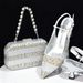 Accessorize the evening with shredded diamond embellished high-heeled sandals and a hard-box handbag set_vogvips.com