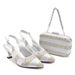 Accessorize the evening with shredded diamond embellished high-heeled sandals and a hard-box handbag set_vogvips.com