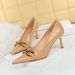 Women's high-heeled stiletto pumps with patent leather and metal buckles_vogvips.com