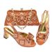 Accessorize the party with a bow with a shredded diamond round head fish mouth square and sandals with the same style clutch_vogvips.com