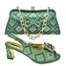 Accessorize the party with a bow with a shredded diamond round head fish mouth square and sandals with the same style clutch_vogvips.com