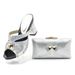 Plus-size women's chunky and rhinestone slippers paired with a dinner party clutch set_vogvips.com