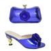 Pair the evening with a glossy glossy high heel round head fish mouth sandals and a three-dimensional decal decorated clutch set_vogvips.com