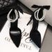 2025 Fall New Pearl Black Women's Fashion Stiletto Suede Hollow One-Strap Buckle High Heels_vogvips.com