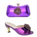 Pair the evening with a glossy glossy high heel round head fish mouth sandals and a three-dimensional decal decorated clutch set_vogvips.com