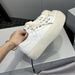 2025 New Thick-Soled Canvas Shoes For Women With Cross Flower Design, Height-Increasing Black And White Color-Block_vogvips.com