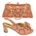 Accessorize the party with a bow with a shredded diamond round head fish mouth square and sandals with the same style clutch_vogvips.com